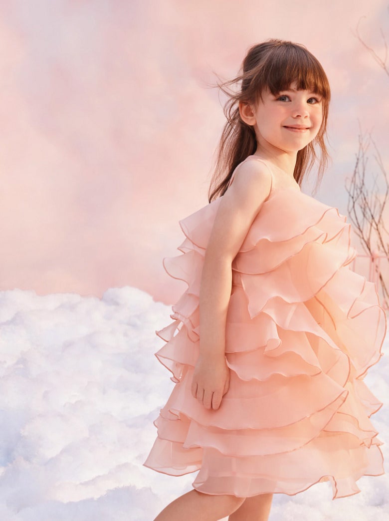 girl in baby pink ruffle holiday dress 