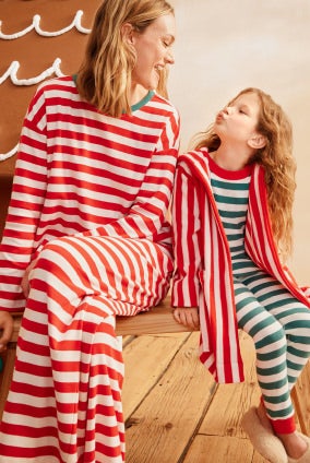adult and girl in red & green striped pajamas
