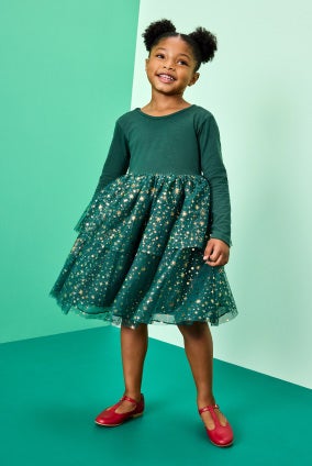 girl in green holiday dress