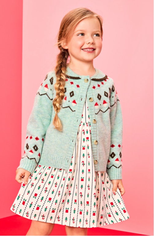 girl in holiday dress and cardigan