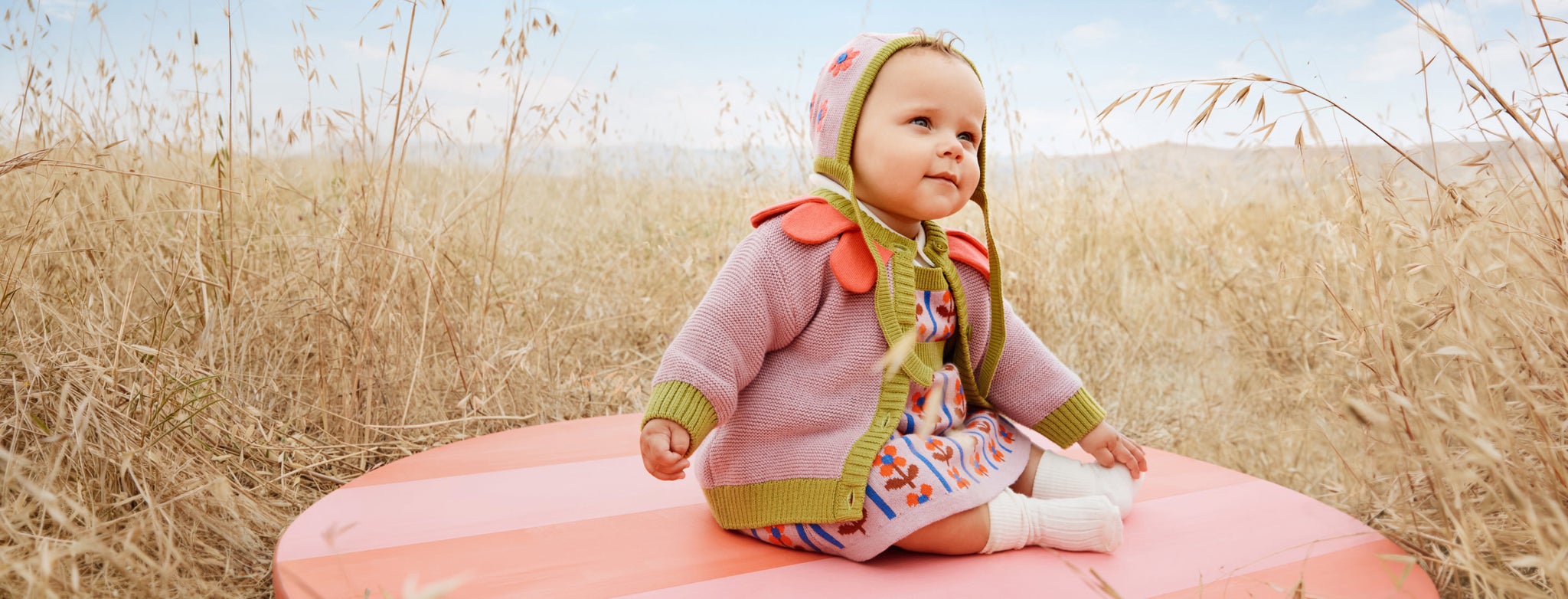baby's first cozy season baby in fall clothes