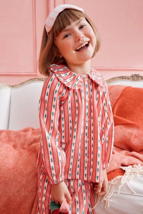 girl in pink flannel pajamas