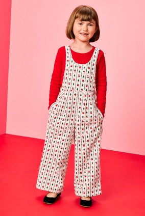 girl in holiday jumpsuit