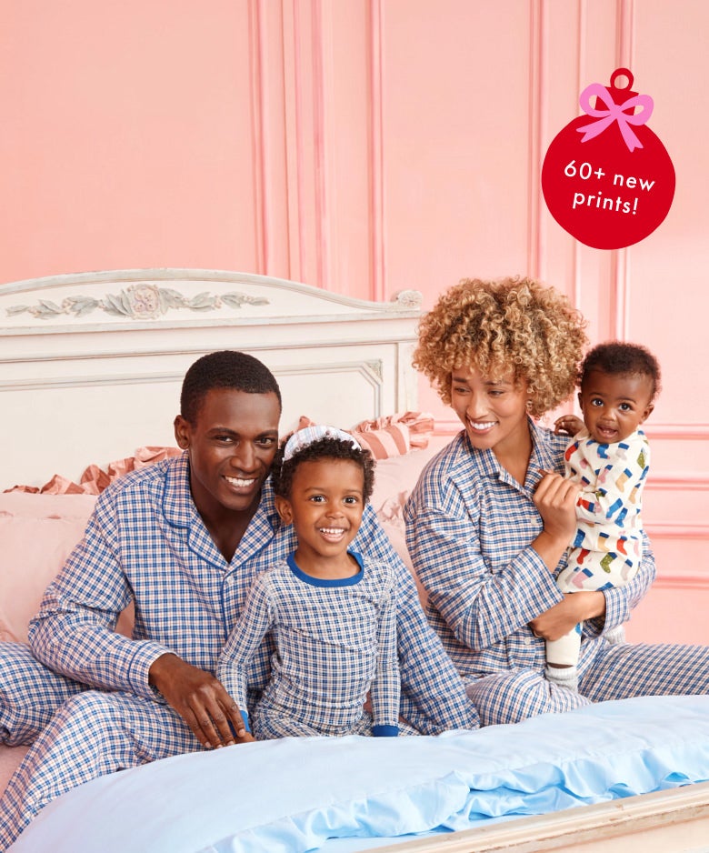 family in matching blue plaid holiday pajamas