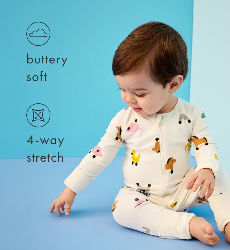 baby wearing HannaJams™ organic baby pajamas with descriptive text