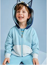 A child in a bluey-themed hoodie